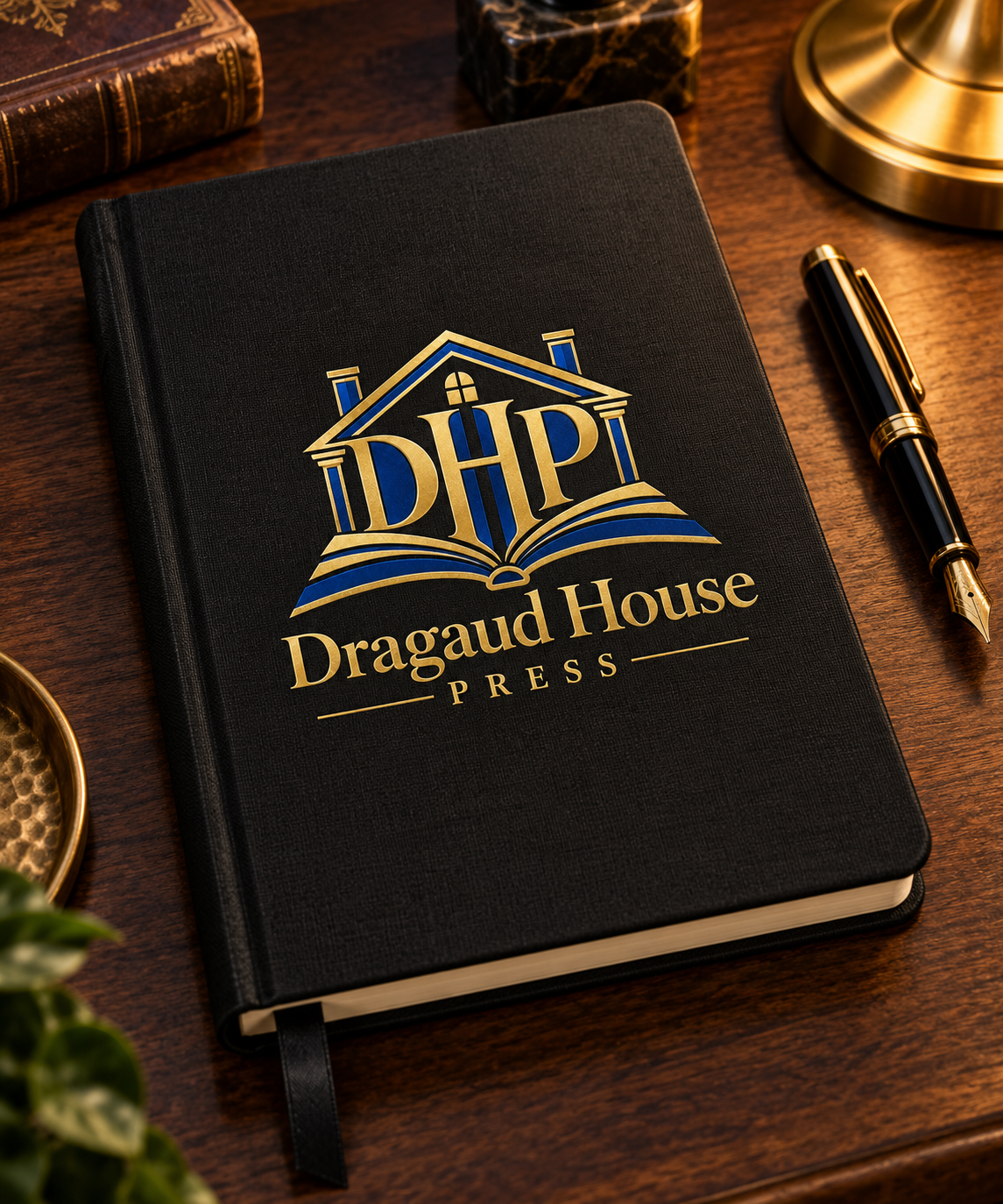 Black Dragaud House Press journal with the blue-and-gold house-and-book crest